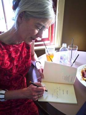 Sarah Day signs a copy of Tempo at the launch at the Friend in Hand Hotel. (Photo Robert Adamson)