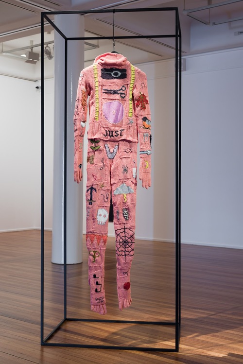 Post-script: A Burial Suit, Kate Just 2013. right: hand knitted merino and bamboo yarn, cotton, rayon, steel Work including steel frame is 220 x 90 x 65 cm; Photo at right by Catherine Evans. Kate Just is represented by Daine Singer.